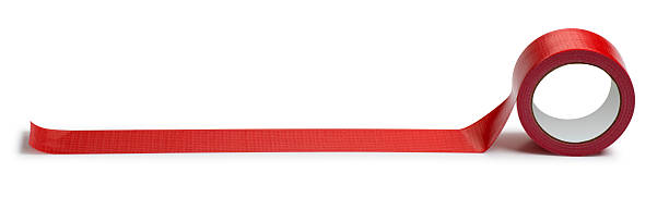 Adhesive Red Tape Isolated on White This is a photo taken in the studio of a roll of red duct tape isolated on a white background. There is a clipping path included with this file. bureaucracy stock pictures, royalty-free photos & images