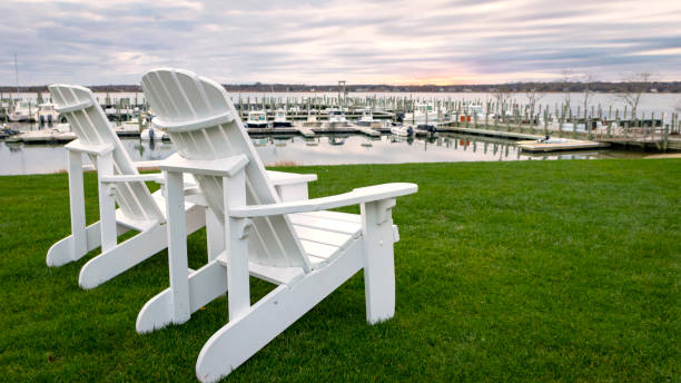 Adirondack chairs by the waterfront stock photo
