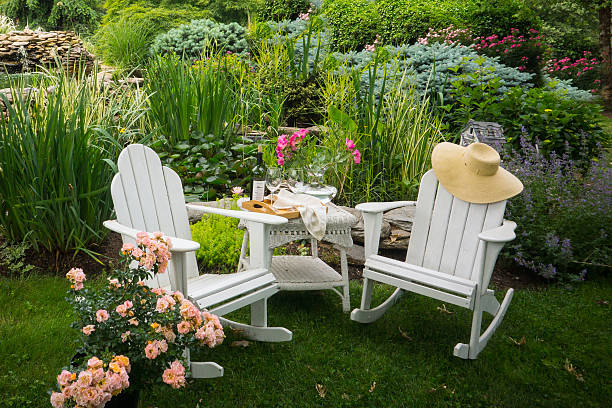 Adirondack chairs in the garden stock photo