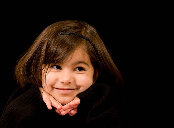 Adorable Little Girl on Black stock photo