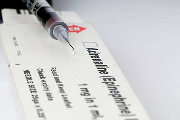 Adrenaline Junkie A syringe and a box for adrenaline. Shot with tilt/shift lens for increased depth of field. adrenaline stock pictures, royalty-free photos & images