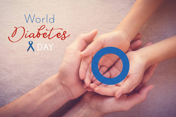 adult and child holding blue circle, copy space background, World Diabetes day adult and child holding blue circle, copy space background, World Diabetes day diabetes awareness month stock pictures, royalty-free photos & images