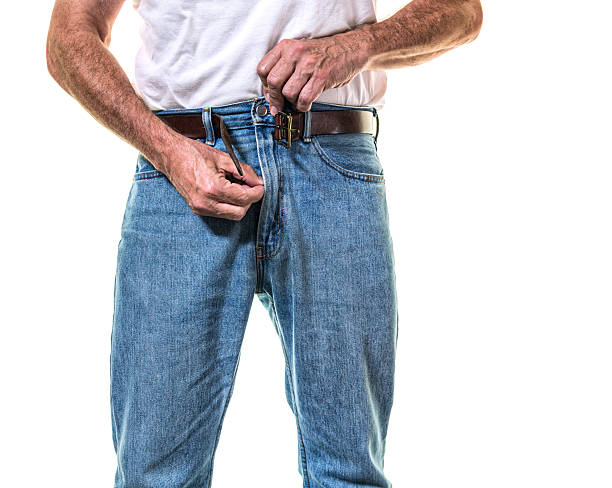 adult-man-getting-dressed-zipping-jeans-