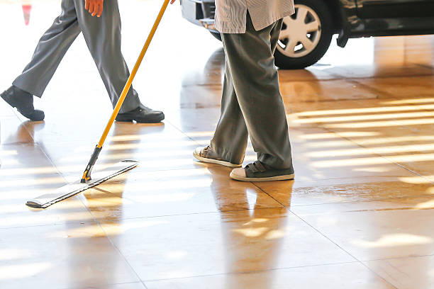 Adult man mopping floor Adult man mopping floor carpark cleaning stock pictures, royalty-free photos & images