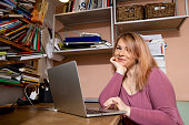 istock Adult woman working from her mini home-office 1395371426