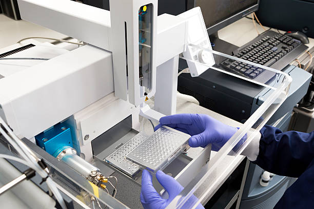 Advanced Medical Technology Testing A scientific medical machine, used to sample and detect disease and substances. The Equipment is very high tech and innovative. immunology stock pictures, royalty-free photos & images