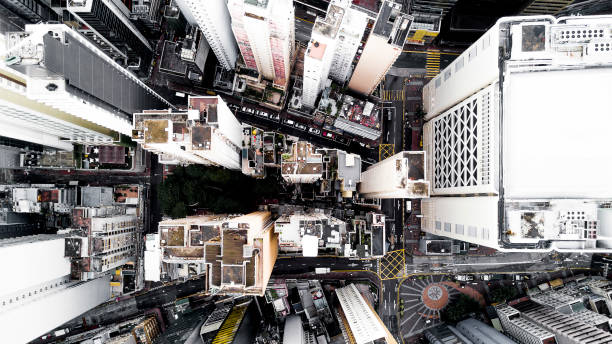Aerial city view with crossroads and roads, houses, buildings and parking lots. Helicopter drone shot. Wide Panoramic image of Hong Kong. stock photo