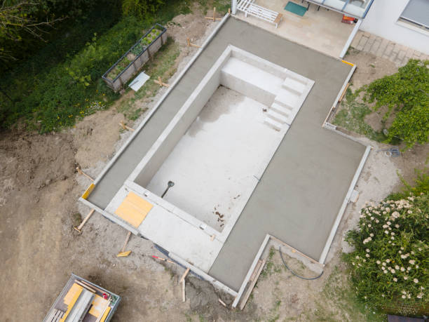 aerial drone flight pic of Swimming pool construction site from above stock photo