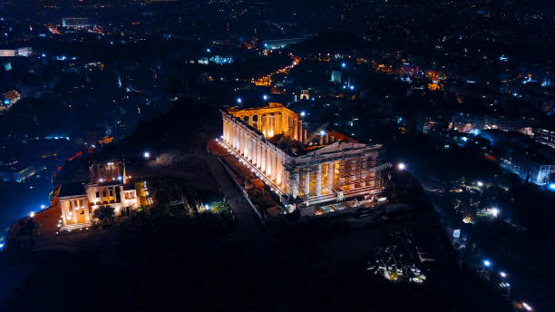 Aerial drone night photo of Acropolis hill and the Parthenon, Athens historic center, Greece stock photo