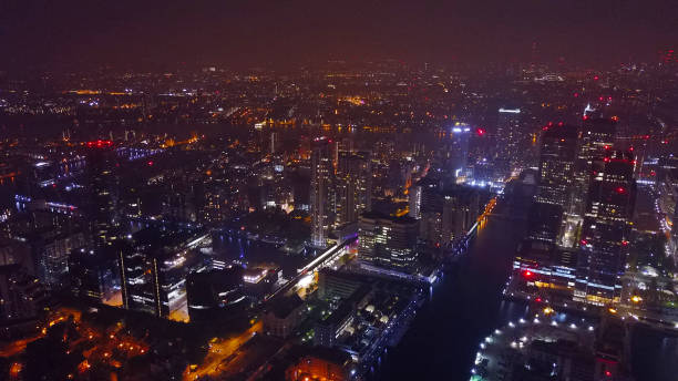 Aerial drone night photo of Canary Wharf area, Docklands, London, United Kingdom stock photo