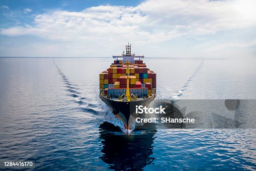 istock Aerial front view of a loaded container cargo vessel 1284416170
