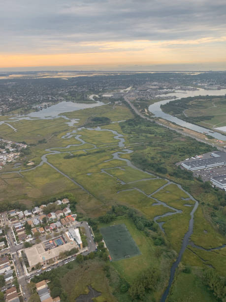 aerial ⁨John F. Kennedy International Airport at dawn ⁨aerial John F. Kennedy International Airport⁩, ⁨Long Island⁩, ⁨Jamaica⁩, ⁨New York⁩, ⁨United States⁩ new jersey street flooding stock pictures, royalty-free photos & images