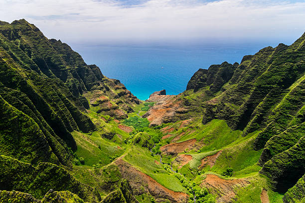 Aerial landscape view of cliffs and green valley, Kauai stock photo