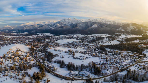Aerial landscape with tatra mountains and Zakopane, winter scenery of Giewont Peak. stock photo