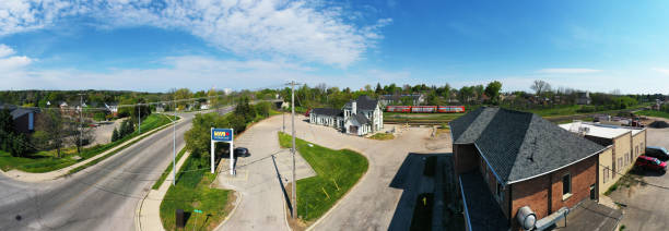 Aerial panorama of an old train station in Woodstock, Ontario, Canada An aerial panorama of an old train station in Woodstock, Ontario, Canada. Built in 1885 for the CNR, it is used by ViaRail and has a Historic Designation. woodstock ontario stock pictures, royalty-free photos & images