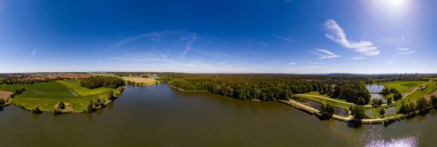 Aerial panoramic view of a small lake in the district of Buechenbach of the city of Erlangen stock photo