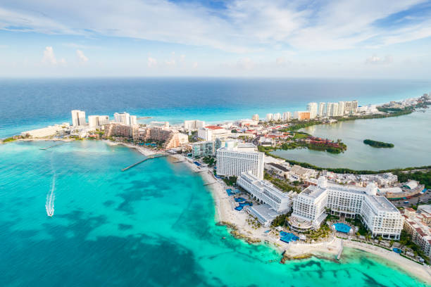 Aerial panoramic view of Cancun beach and city hotel zone in Mexico. Caribbean coast landscape of Mexican resort with beach Playa Caracol and Kukulcan road. Riviera Maya in Quintana roo region on Yucatan Peninsula stock photo