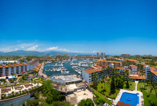 Aerial panoramic view of Marina Vallarta in Puerto Vallarta Panoramic view from the air on a clear day of the Marina in Puerto Vallarta puerto vallarta stock pictures, royalty-free photos & images