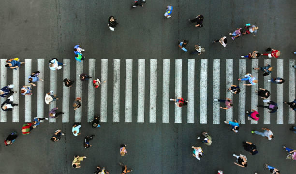 Aerial. Pedestrian crowd crossing. Top view. Aerial. Pedestrian crossing. crosswalk stock pictures, royalty-free photos & images