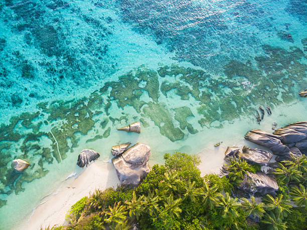 Aerial photo of Seychelles beach at La Digue Aerial photo of Seychelles tropical beach Anse Source D Argent at La Digue island indian ocean stock pictures, royalty-free photos & images