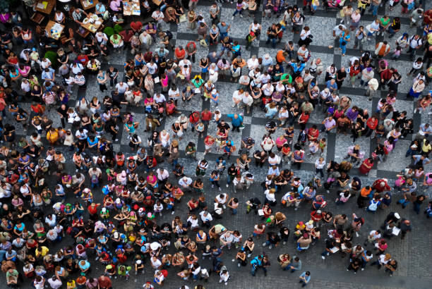 Aerial photograph of people gathered in a square Aerial photograph of people visiting the Old Town Square in Prague prague old town square stock pictures, royalty-free photos & images