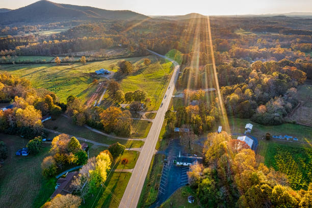 Aerial shot of backlit road in Georgia Mountains during the sunset in the Fall season stock photo