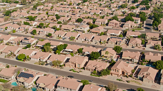 Aerial shot of residential streets in Gilbert, Arizona on a clear sunny day

Authorization was obtained from the FAA for this operation in restricted airspace.