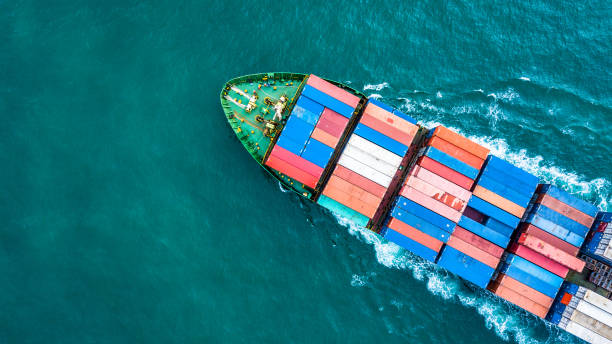 Aerial top view container cargo ship, Business logistic and transportation of International by ship in the open sea. Aerial top view container cargo ship, Business logistic and transportation of International by ship in the open sea. container ship stock pictures, royalty-free photos & images