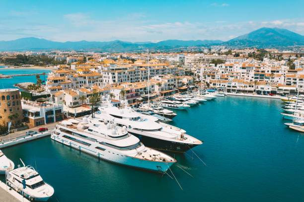 Aerial top view of luxury yachts in Puerto Banus marina, Marbella, Spain Aerial top view of luxury yachts in Puerto Banus marina, Marbella, Spain. High quality photo costa del sol málaga province stock pictures, royalty-free photos & images