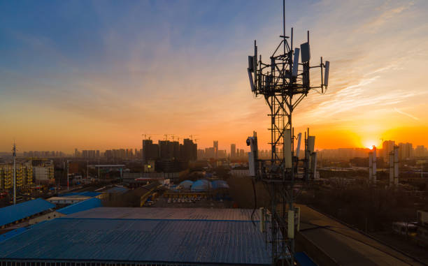 Aerial view 5G cellular communications tower Aerial view 5G cellular communications tower communications tower photos stock pictures, royalty-free photos & images