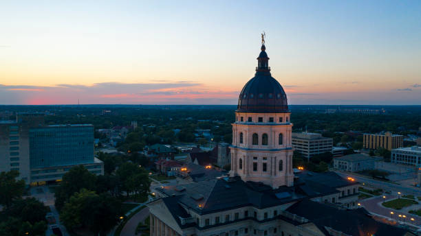 Aerial View at Sunset over the State Capital Building in Topeka Kansas USA Pink and Orange light remains after the Sun hides away behind the horizon in Topeka Kansas topeka stock pictures, royalty-free photos & images