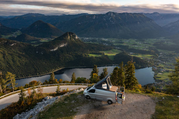 Aerial View Camper Van Alone Near Mountain Road stock photo