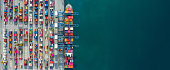 istock Aerial view container ship in port at container terminal port, Ship of container ship stand in terminal port on loading, unloading container, Commercial cargo ship in sea port. 1319941084