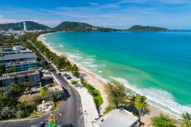 Aerial view Drone camera Amazing sea nature view over Patong city Phuket Thailand in the morning Beautiful patong beach in summer season stock photo
