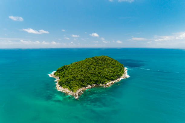 Aerial view landscape of small island in tropical sea against blue sky background Amazing small island at Phuket Thailand stock photo