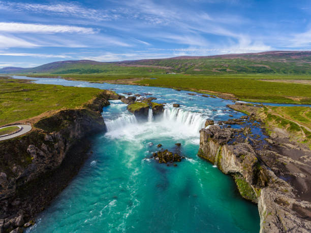 Aerial view landscape of the Godafoss famous waterfall in Iceland. Aerial view landscape of the Godafoss famous waterfall in Iceland. The breathtaking landscape of Godafoss waterfall attracts tourist to visit the Northeastern Region of Iceland. dettifoss waterfall stock pictures, royalty-free photos & images
