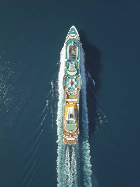 Aerial view large cruise ship at sea, Passenger cruise ship vessel, sailing across the Ksamil, Albania. View from drone. Aerial view large cruise ship at sea, Passenger cruise ship vessel, sailing across the Ksamil, Albania. View from drone. cruise vacation stock pictures, royalty-free photos & images