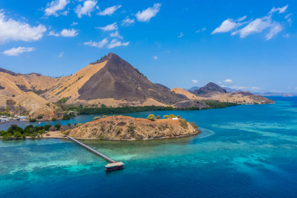 Aerial view of beaches and tourist boat sailing in Kelor Island, Flores Island, Indonesia stock photo