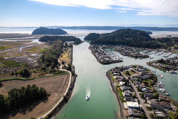 Aerial View of Boat in Swinomish Channel by Shelter Bay in Washington State stock photo