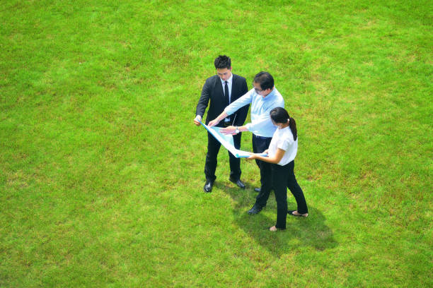 Aerial View of Business People Looking Blueprint stock photo