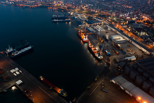 Aerial view of an International port, Business logistics concept, Cargo Container ship in import export and business logistics, Shipping harbor. Ro Ro ship, freight ship and container ship in a port.