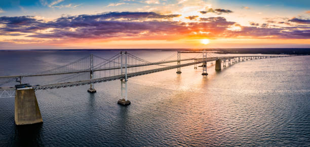 Aerial view of Chesapeake Bay Bridge at sunset. Aerial panorama of Chesapeake Bay Bridge at sunset. The Chesapeake Bay Bridge (known locally as the Bay Bridge) is a major dual-span bridge in the U.S. state of Maryland. chesapeake bay stock pictures, royalty-free photos & images