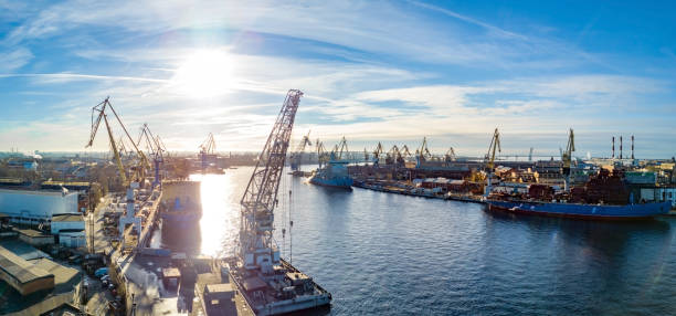 Aerial view of city port in sunny day with shipyard silhouettes stock photo