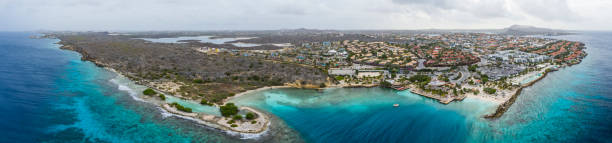 Aerial view of coast of Curacao in the Caribbean Sea with turquoise water, cliff, beach and beautiful coral reef stock photo