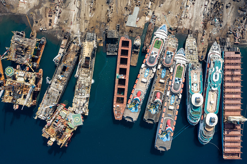 Aerial view of cruise ships being broken down for scrap