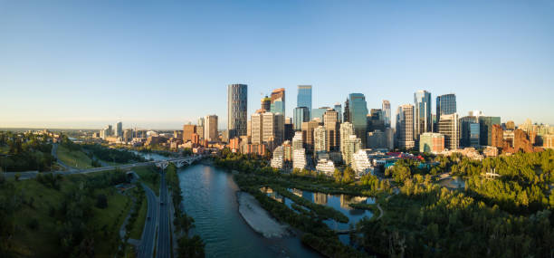 Aerial View of Downtown Calgary Aerial panoramic view of a beautiful modern cityscape during a vibrant sunny sunrise. Taken in Calgary Downtown, Alberta, Canada. calgary stock pictures, royalty-free photos & images