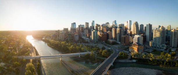 Aerial View of Downtown Calgary Aerial panoramic view of a beautiful modern cityscape during a vibrant sunny sunrise. Taken in Calgary Downtown, Alberta, Canada. calgary stock pictures, royalty-free photos & images