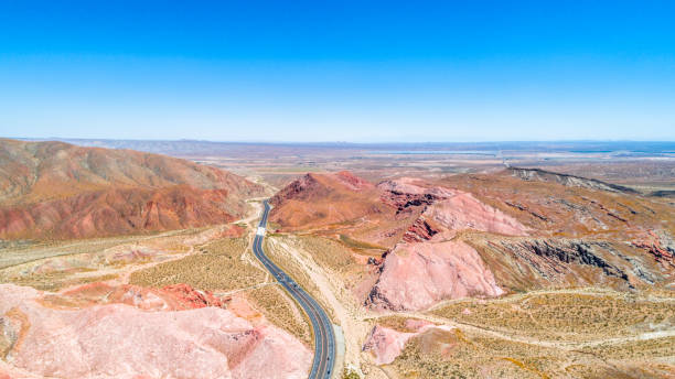 Aerial view of empty road surounded by Red Rock Canyon rocks, Nevada, USA stock photo