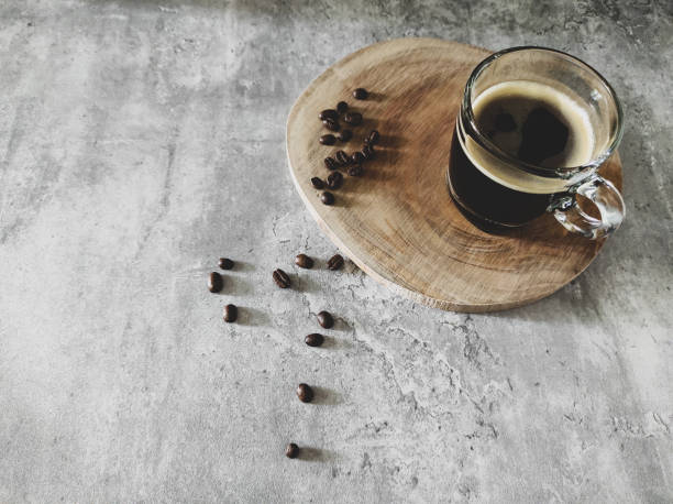 Aerial view of espresso and coffee beans on grey table stock photo