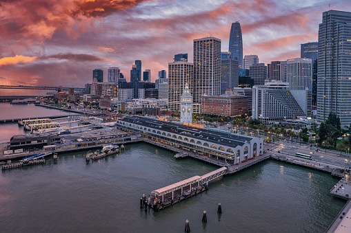 An aerial view of a fiery sky at sunrise over the Ferry Terminal in San Francisco.